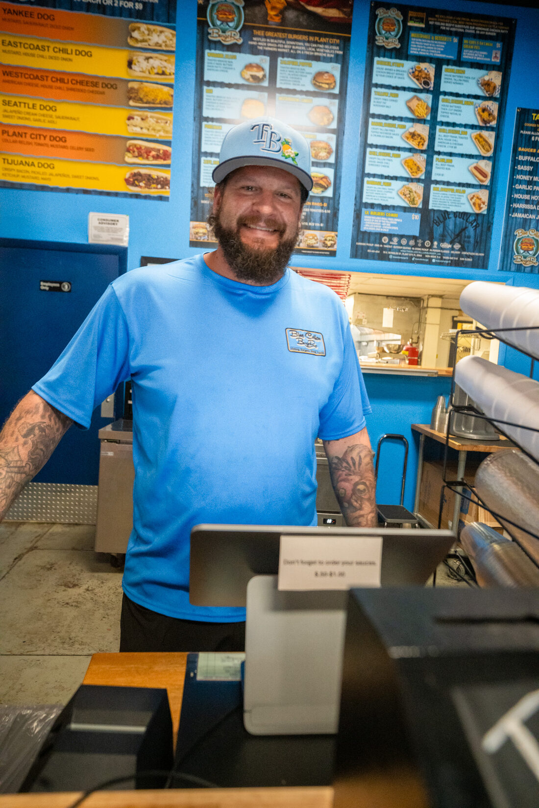 A Blue Collar Burger cook behind the counter at the Plant City shop